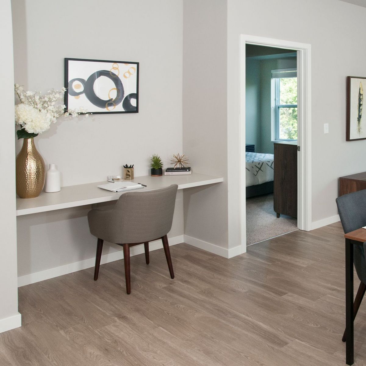 Viridian Central An inviting dining area featuring a table and chairs, perfect for family meals.
