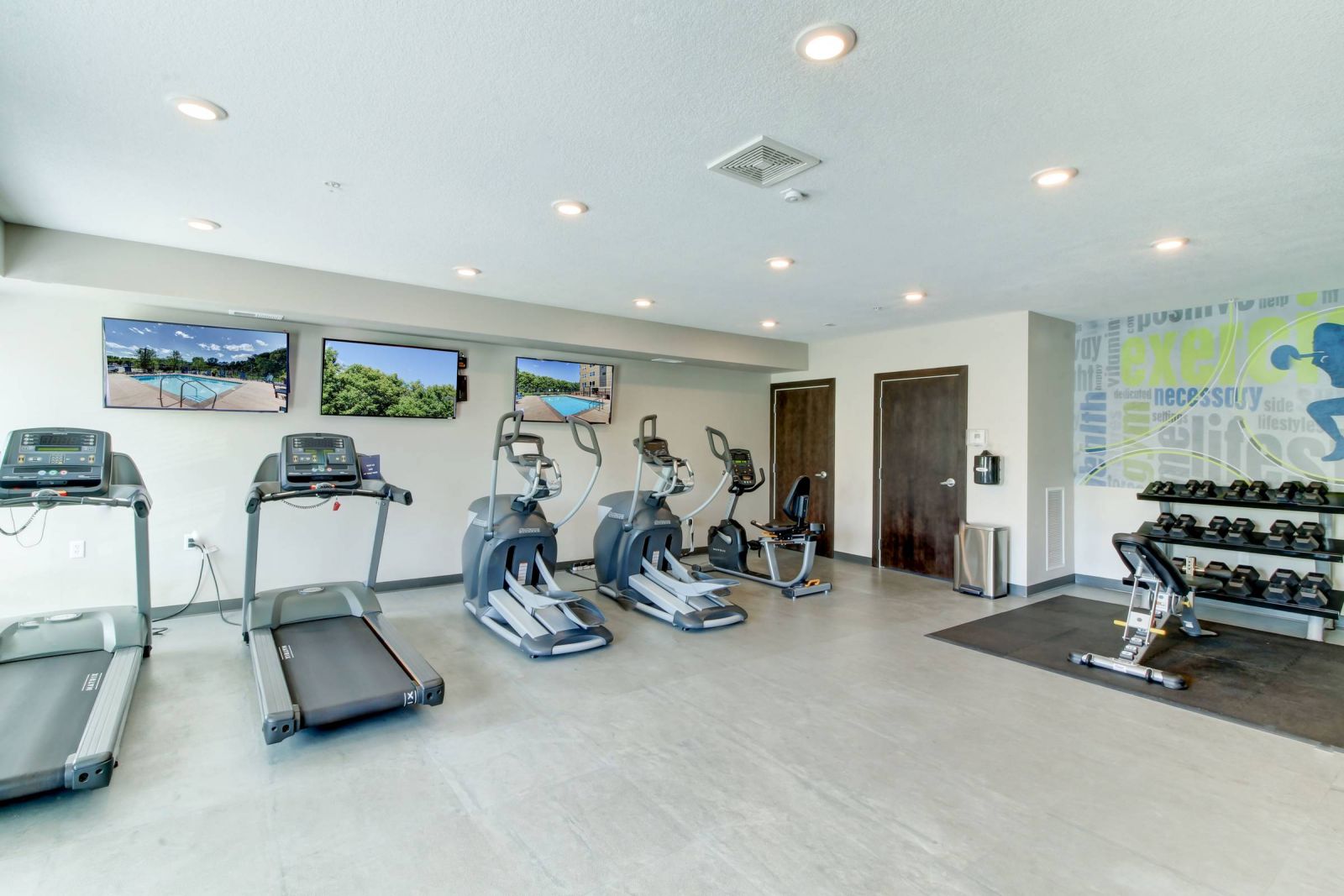 Viridian Central A gym room with treadmills and exercise equipment.